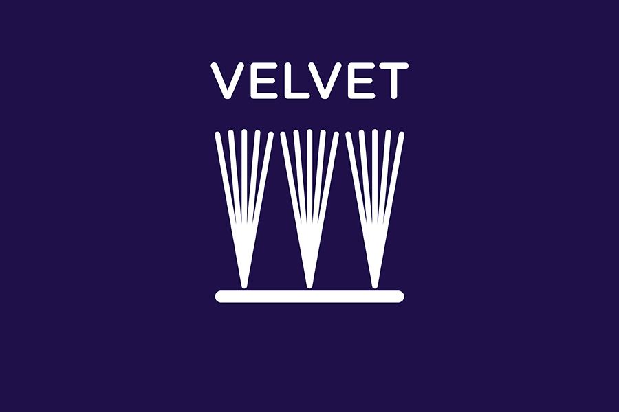 Cross section of cut yarns in a velvet carpet on a neutral carpet background